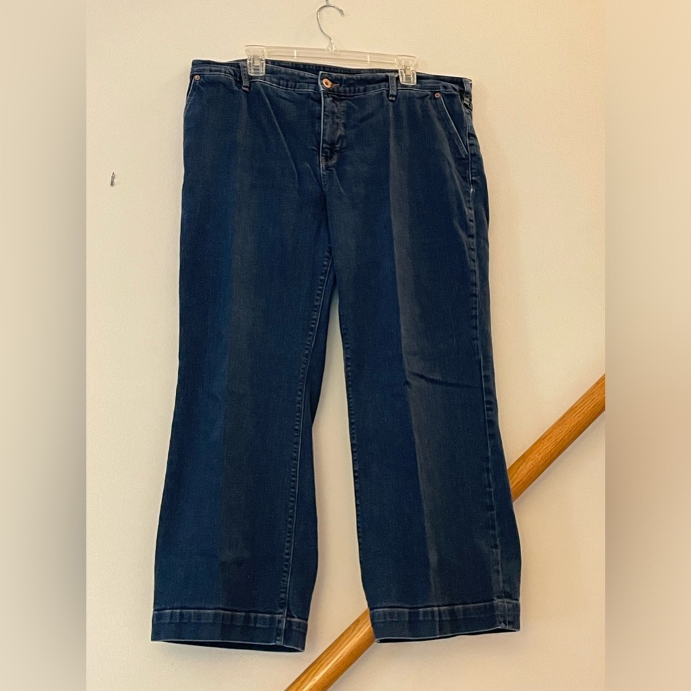 Dark denim trouser jeans with a wide leg.